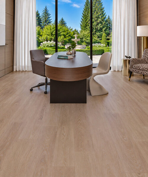 Sandstorm - 7/16&Quot; (11Mm) - Swiss Design Cork Floating (Fsan11) Sandstorm Beige Wood-Grain Cork Floating Flooring In A Comfortable Home Office With A Curved Desk, Wood-Paneled Walls, And Garden View.