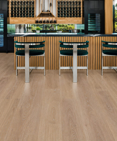Usa'S Best Cork Flooring, Wall Tiles, Underlayment And More Sandstorm Light-Beige Wood-Grain Cork Floating Flooring In A Luxury Home Wine Bar With Bottle Storage, Wine Coolers, And A Slatted Island.