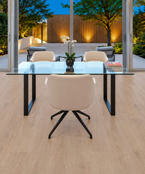 Sandstorm - 7/16&Quot; (11Mm) - Swiss Design Cork Floating (Fsan11) Comfortable Sandstorm Light-Tan Cork Floating Flooring In A Contemporary Home Office With A Glass Desk, Stone Fireplace, And Illuminated Courtyard.