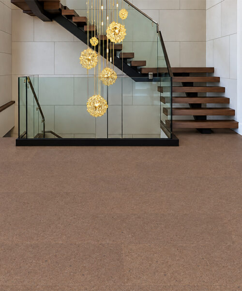 Shoreline - 25/64&Quot; (10Mm) - Cork Floating (Fshol10) Shoreline 10Mm Floating Cork Flooring Shows A Subtle Mid-Brown Speckled Pattern Beside Glass-Railed Stairs.
