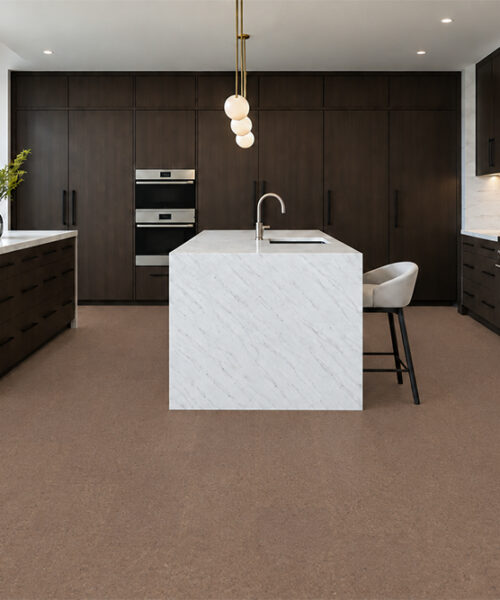 Shoreline - 25/64&Quot; (10Mm) - Cork Floating (Fshol10) Natural Mid-Brown Shoreline Cork Floor Planks Complement Dark Wood Cabinets And A White Waterfall Island.