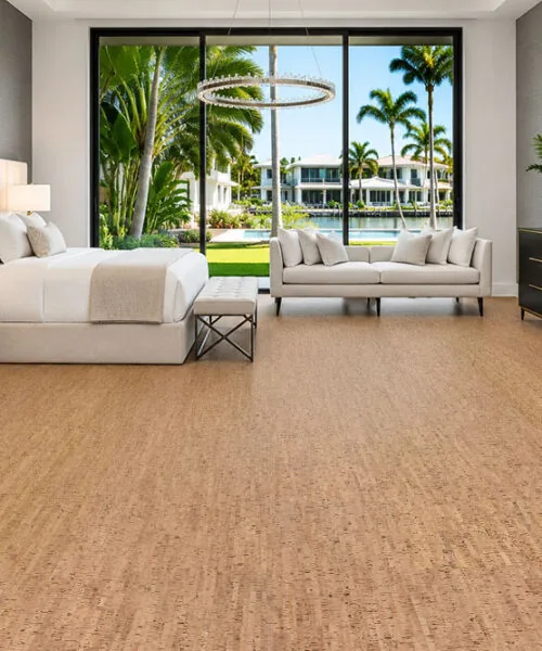 Silver Birch cork flooring in a bright contemporary bedroom with large windows and modern furniture.