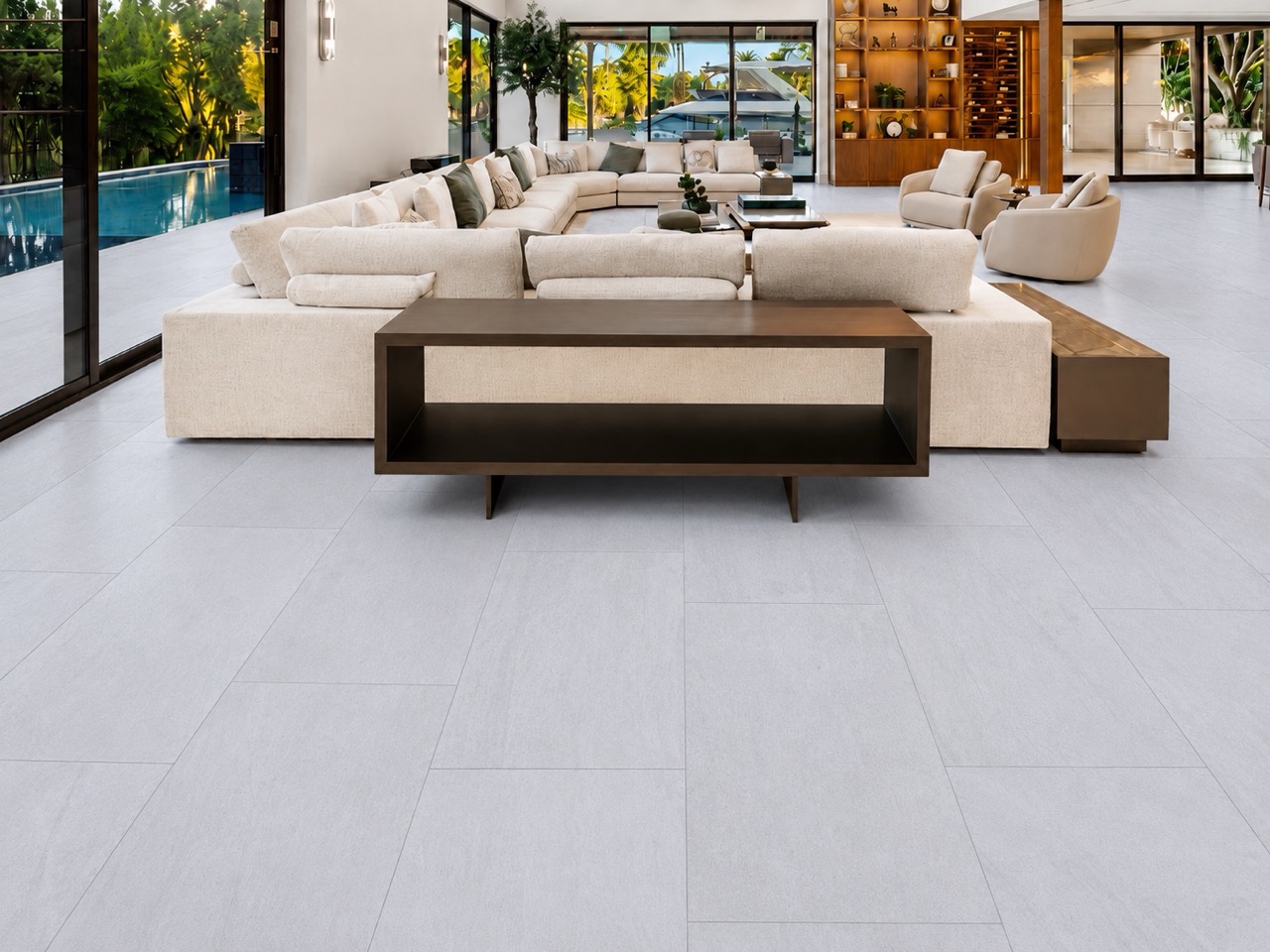 Snowstone - 19/64&Quot; (7.5Mm) - Swiss Techslate (Mcsnows7.5) Snowstone Techslate Flooring In A Pale Gray Mineral Pattern Anchors A Spacious Living Room With Sectional Seating And Dark Wood Furniture.