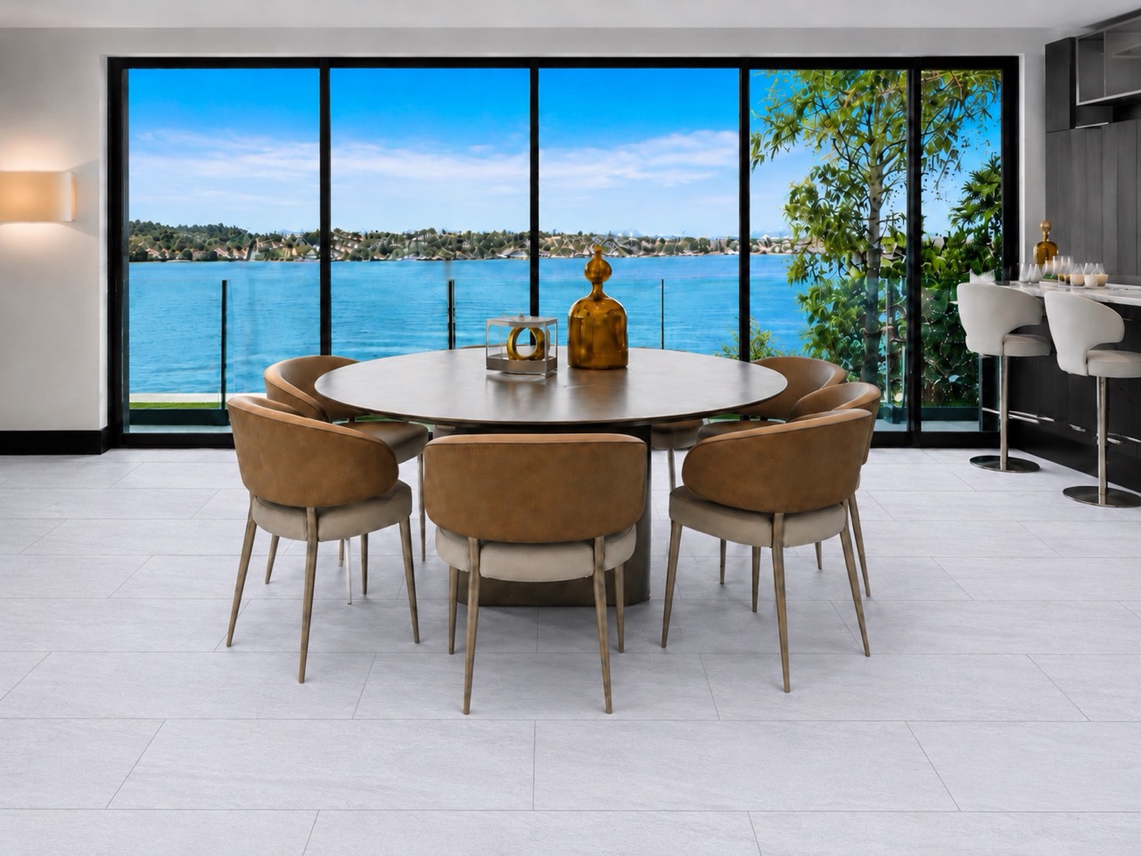 Snowstone - 19/64&Quot; (7.5Mm) - Swiss Techslate (Mcsnows7.5) Snowstone Sustainable Flooring With Subtle Pale Gray Surface Variation Appears Beneath A Round Dining Table Overlooking A Blue Waterfront.