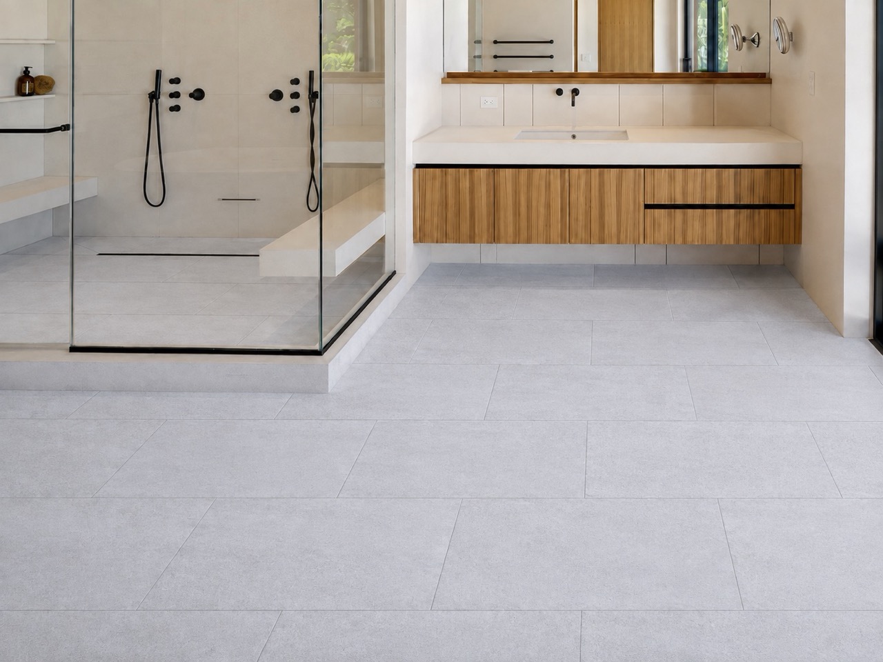 Snowstone - 19/64&Quot; (7.5Mm) - Swiss Techslate (Mcsnows7.5) Snowstone Waterproof Floating Flooring Shows A Pale Gray Concrete-Look Pattern In A Modern Bathroom With A Glass Shower And Wood Vanity.