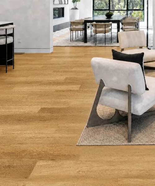 Spanish Cedar - 13/32&Quot; (10.5Mm) - Design Cork Floating (Fsc10.5) Spanish Cedar Golden-Tan Cork Plank Flooring Connecting An Open-Concept Living Room, Kitchen, And Dining Area.