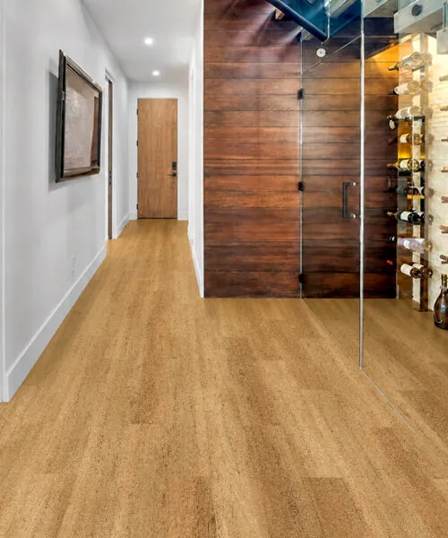 Spanish Cedar - 13/32&Quot; (10.5Mm) - Design Cork Floating (Fsc10.5) Spanish Cedar Natural-Brown Floating Cork Flooring In A Hallway Beside A Glass-Enclosed Wine Cellar.