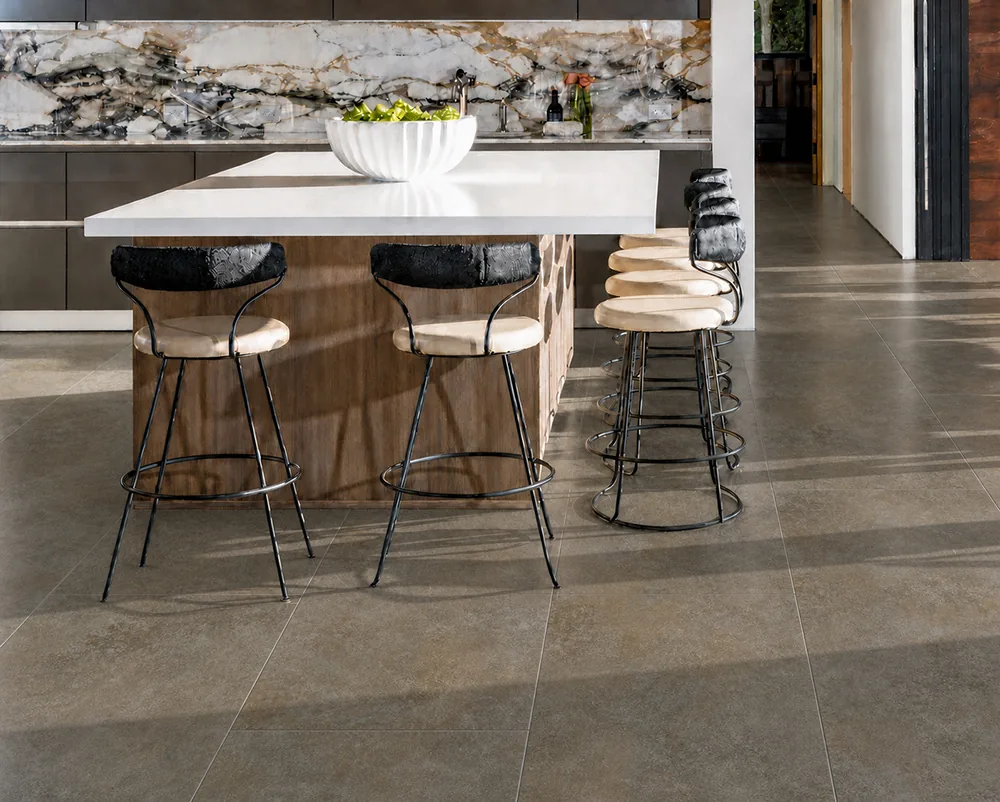 Sunlit Stone - 19/64&Quot; (7.5Mm) - Swiss Techslate (Msunst7.5) Sunlit Stone Brown-Gray Swiss Techslate Flooring In An Open-Concept Kitchen And Dining Room.