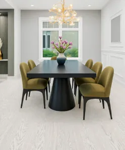 Bright Dining Space Featuring Swiss Snow Cap Real Wood Floating Flooring With A Matte White-Washed Finish, Paired With A Black Modern Table And Green Upholstered Chairs.