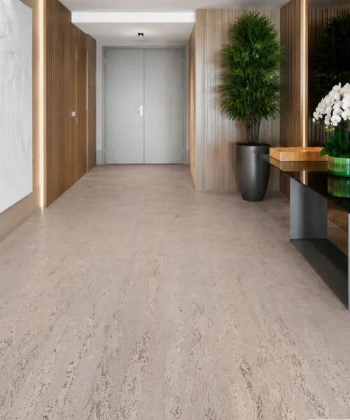 Umber Grey Swiss Real Cork Floating Flooring installed in a modern luxury entryway with light grey cork floor and seamless finish.