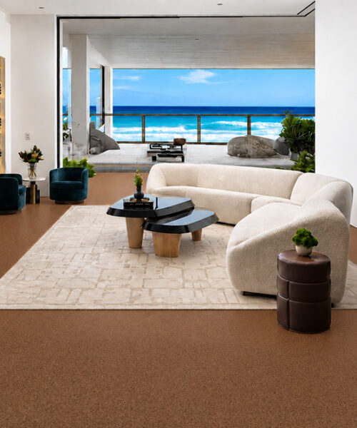 Venetian - 25/64&Quot; (10Mm) - Cork Floating (Fven10) Venetian 10Mm Speckled Floating Cork Flooring Surrounds A Curved Sofa In An Ocean-View Living Room.