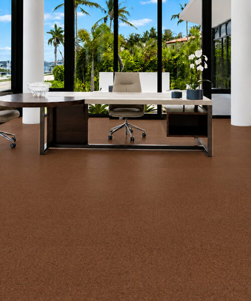 Venetian 10mm natural cork flooring with warm-brown texture grounds a bright tropical-view office.
