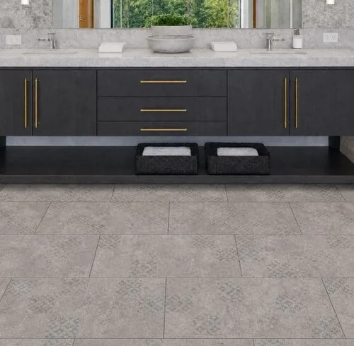 Vintage Stone - 19/64&Quot; (7.5Mm) - Swiss Techslate (Mvinst7.5) Vintage Stone Swiss Techslate Gray Stone-Look Waterproof Flooring In A Luxury Bathroom With Floating Vanity And Marble Countertops.