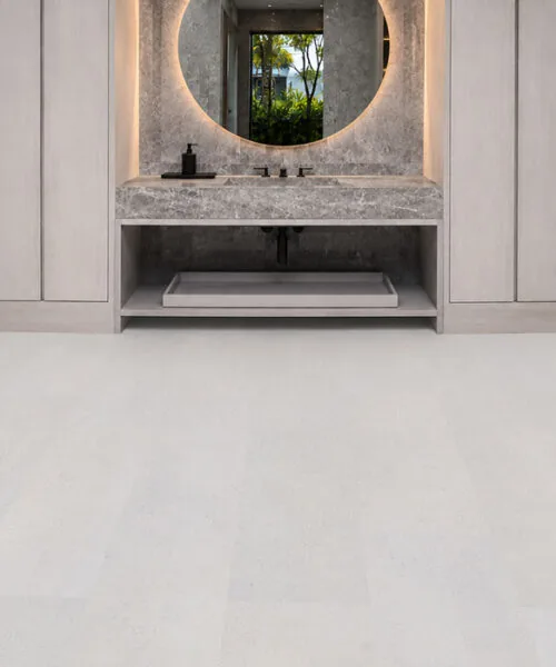 Best Basement Flooring Options - Cork Floating Floors White Leather Cork Flooring In A Luxury Modern Bathroom With Floating Vanity, Marble Countertop, And Seamless White Cork Planks.