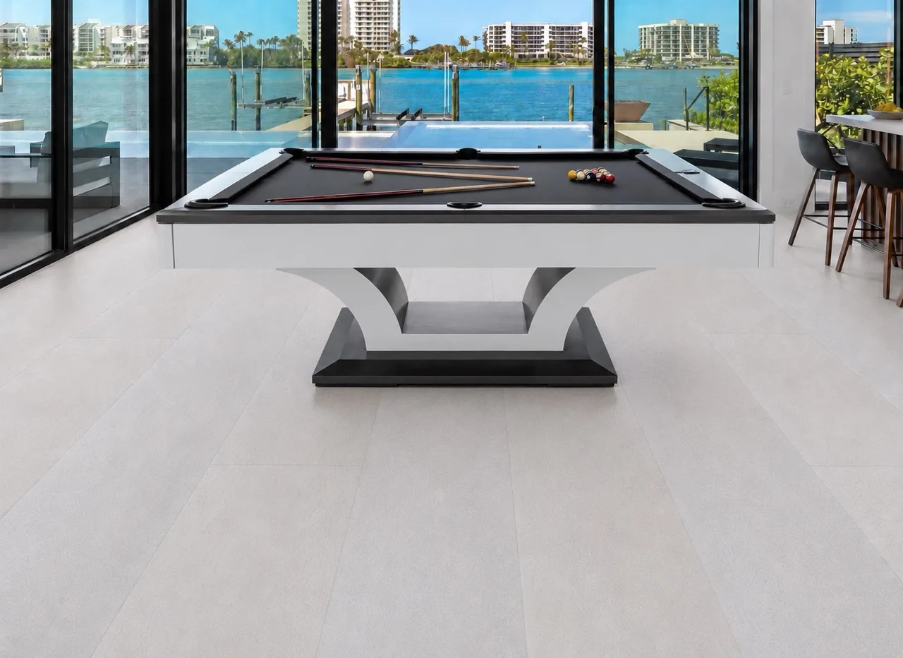 White Leather - 1/2&Quot; (12Mm) - Cork Floating (Fwl12) White Leather Cork Flooring Installed In A Modern Game Room With A Pool Table, Large Windows, And Seamless White Cork Plank Flooring.