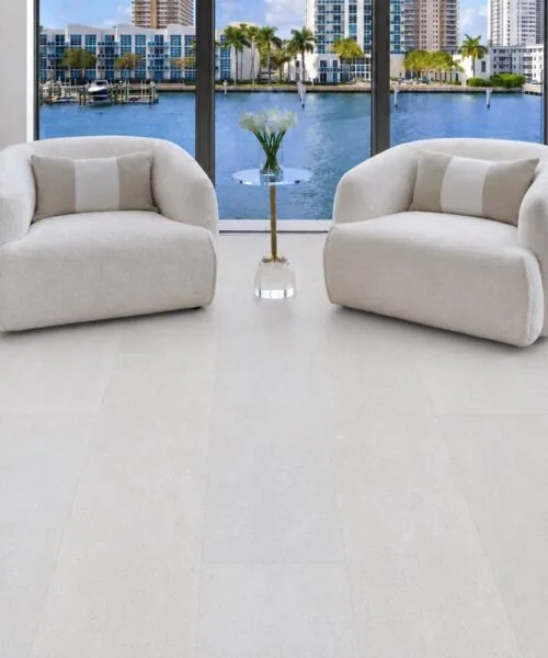 White Leather - 1/2&Quot; (12Mm) - Cork Floating (Fwl12) White Leather Cork Flooring In A Luxury Waterfront Living Room Featuring Seamless White Cork Planks And Modern Lounge Chairs.