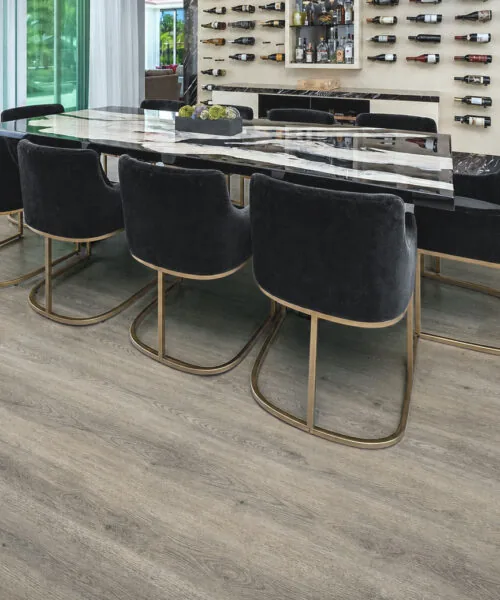 Wild Oak - 13/32&Quot; (10.5Mm) - Design Cork Floating (Fwo10.5) Wild Oak Medium-Gray Cork Flooring With Natural Wood-Grain Planks In A Home Bar And Kitchen.