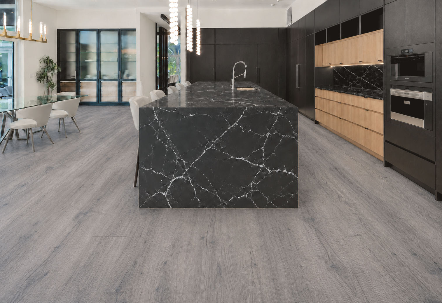Wild Oak - 13/32&Quot; (10.5Mm) - Design Cork Floating (Fwo10.5) Wild Oak Gray Oak-Look Cork Flooring In A Modern Kitchen With A Black Marble Island.
