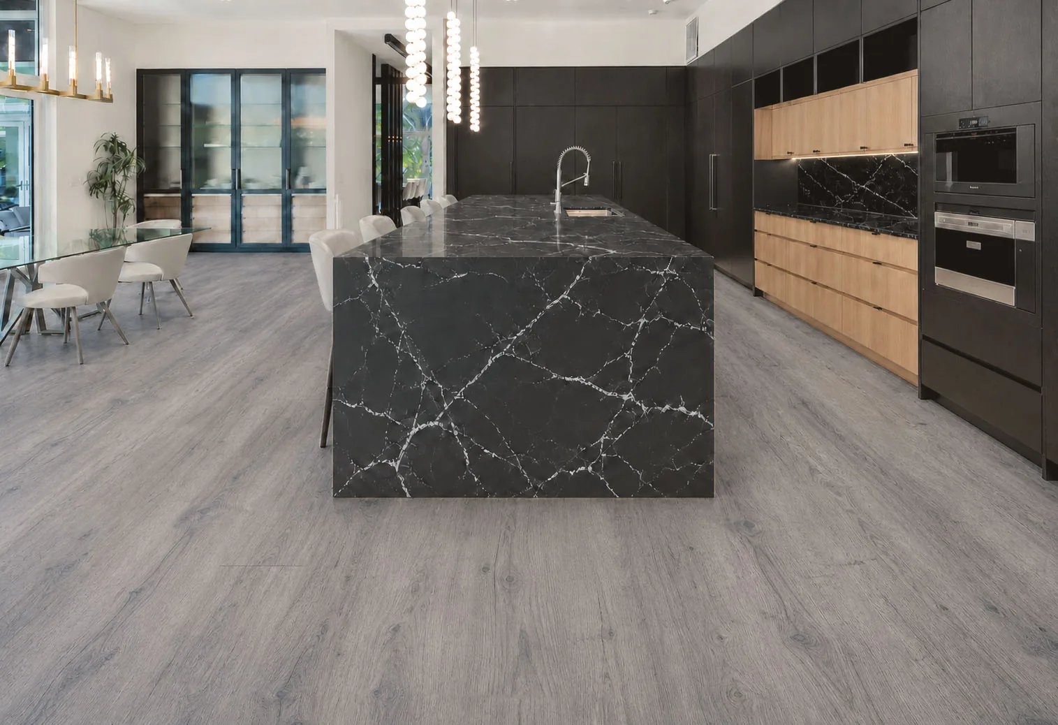 Wild Oak - 13/32&Quot; (10.5Mm) - Design Cork Floating (Fwo10.5) Wild Oak Gray Oak-Look Cork Flooring In A Modern Kitchen With A Black Marble Island.