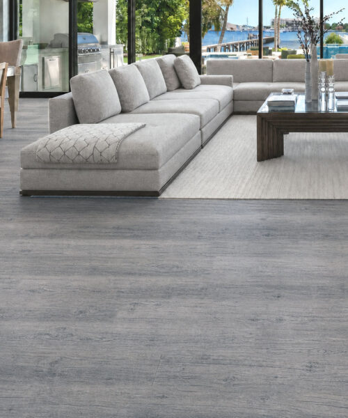 Wild Oak gray cork floating flooring with wide oak-look planks in an open-plan living room.