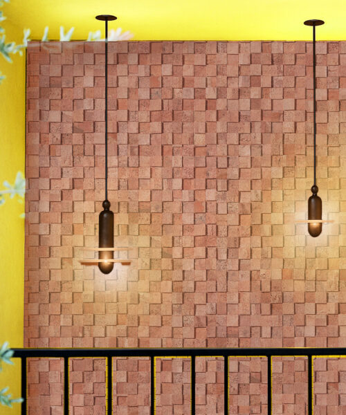 Wood Curb Cork Wall Tiles Installed On A Warm-Toned Wall, Highlighted By Pendant Lighting To Emphasize The 3D Acoustic And Sound-Absorbing Properties Of Natural Cork Panels.