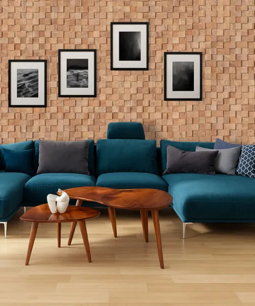 Wood Cubes - 25/64&Quot; (10Mm) - Cork Wall Tiles (Wwocu10) Modern Living Room With A Large Blue Sofa And A Feature Wall Of Wood Curb Cork Wall Tiles, Providing 3D Texture, Soundproofing, And Natural Acoustic Enhancement.