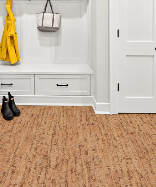 Woodflow 12Mm Medium-Brown Floating Cork Flooring With Linear Grain In A Mudroom With Bench And Rain Boots.