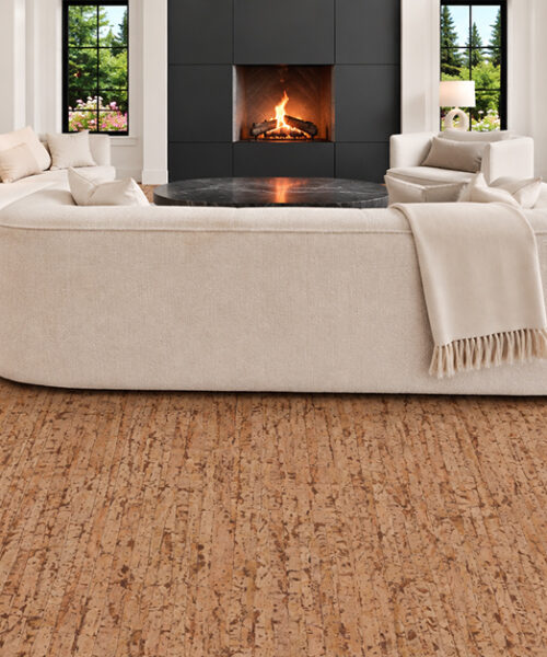 Woodflow natural cork floor planks feature warm brown linear texture in a living room with black fireplace.