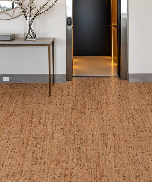 Medium-Brown Woodflow Floating Cork Flooring With Organic Grain In An Entryway With Console And Staircase.
